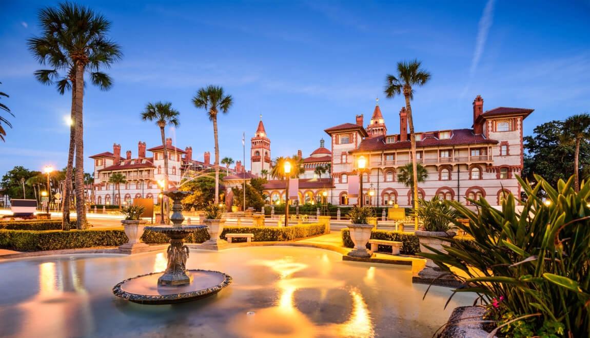 A fountain and palm trees in Jacksonville's Alcazar Courtyard.