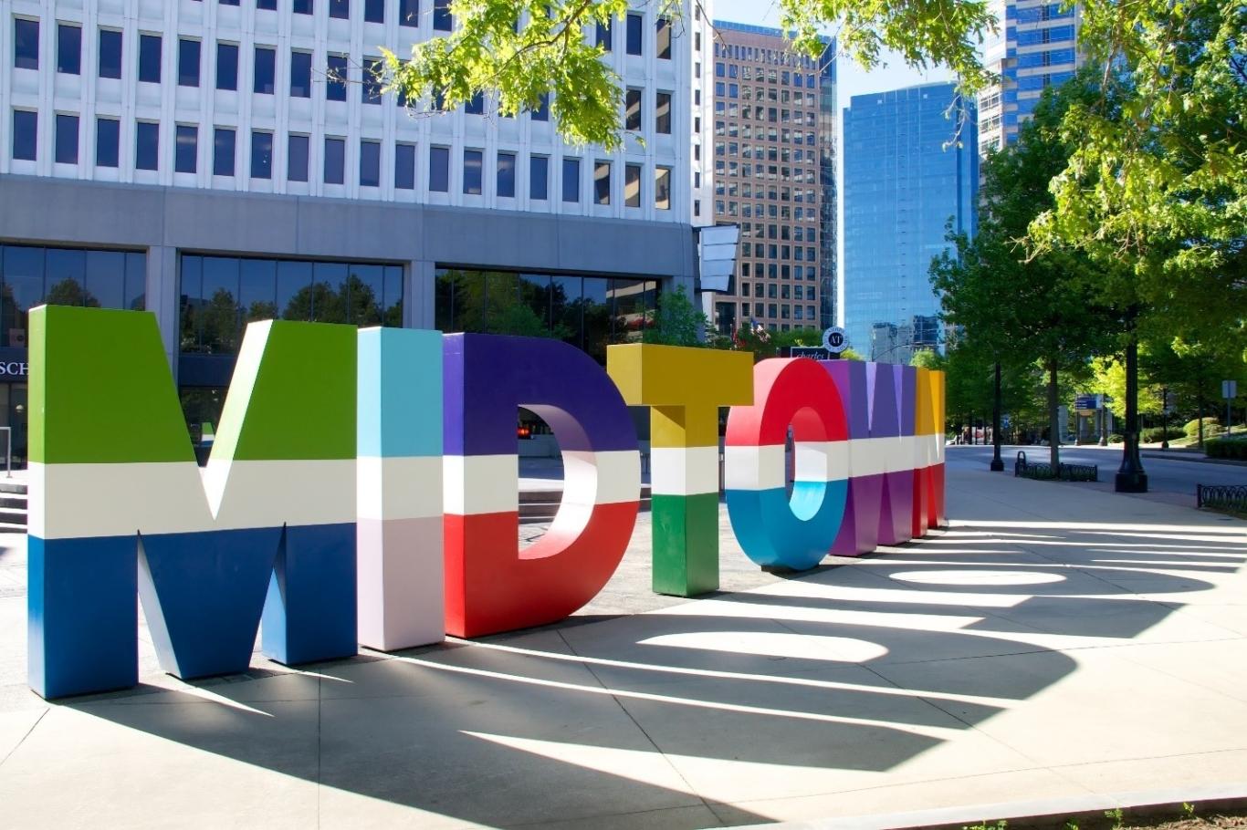 Sign welcomes visitors to Midtown in Atlanta, GA