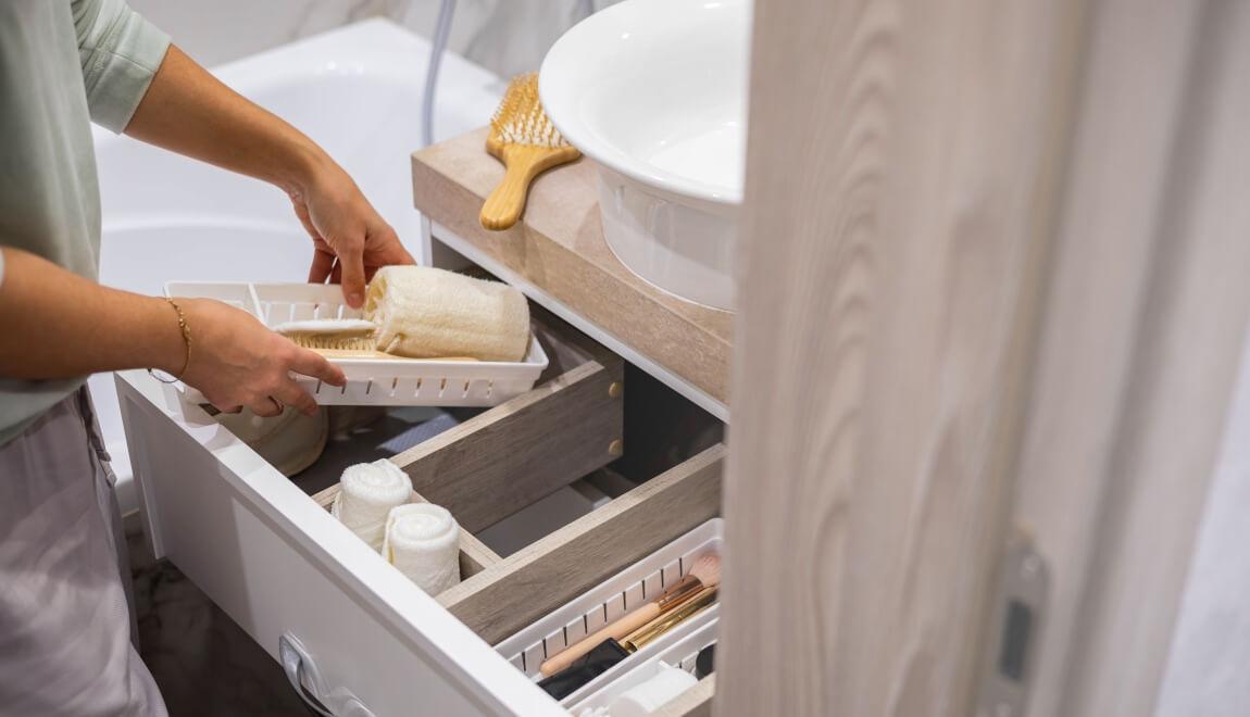 Renter sorting their bathroom drawers.