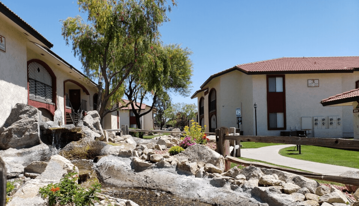 A view of the Spanish-style apartments at Desert Lakes Apartments