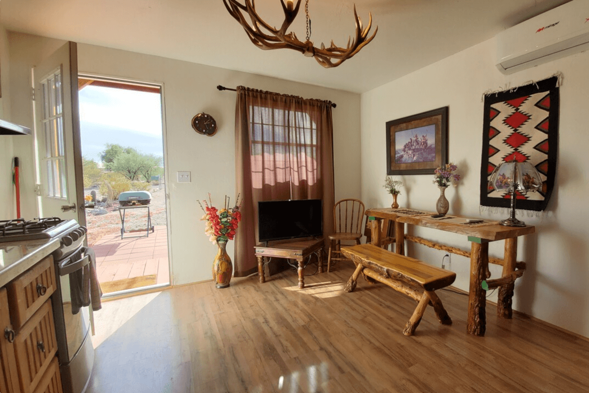 The entryway of 960 West Schwarz Road is filled with natural sunlight and accented with a unique deer-antler chandelier.