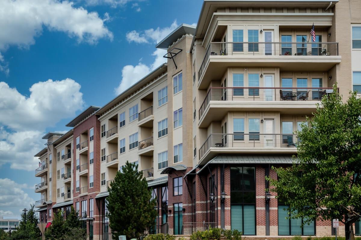 An upscale condominium building has spacious balconies.