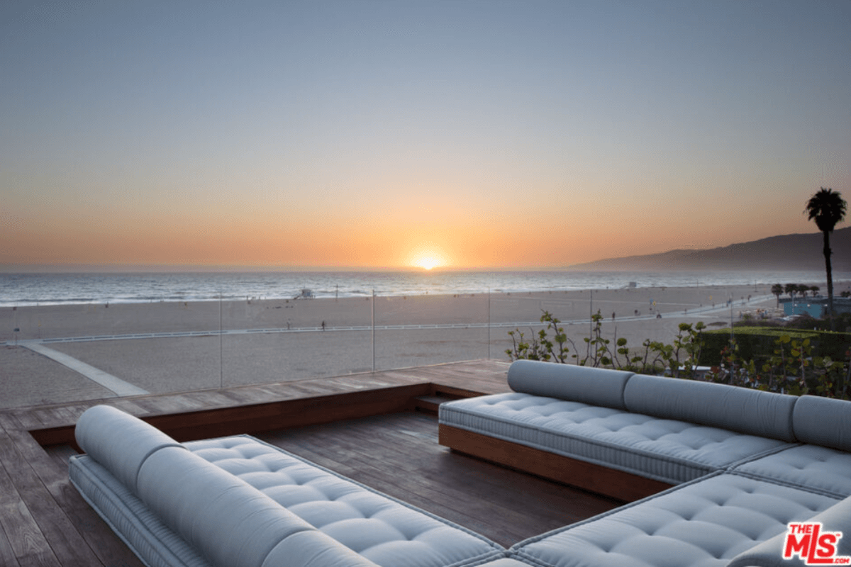 A large lounge area at 547 Palisades Beach Road looks out to the beach.