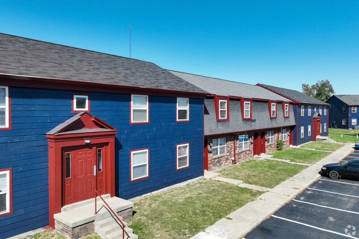 The Spanish Oaks apartment complex has colorful buildings.