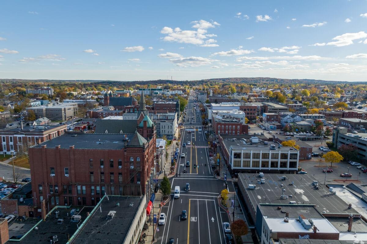 An aerial view of Downtown Nashua shows historic buildings lining Main Street.