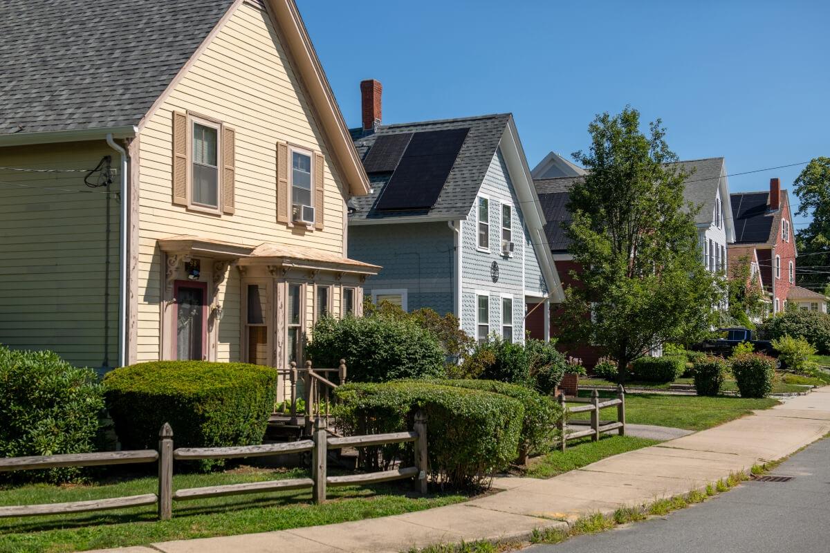 Charming Craftsman-style homes line a residential street in Plymouth, Massachusetts.