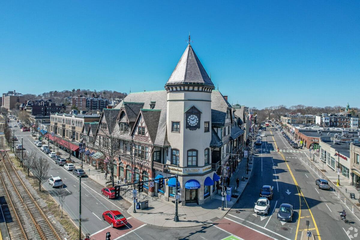 A Tudor-style building sits on a corner in Brookline.