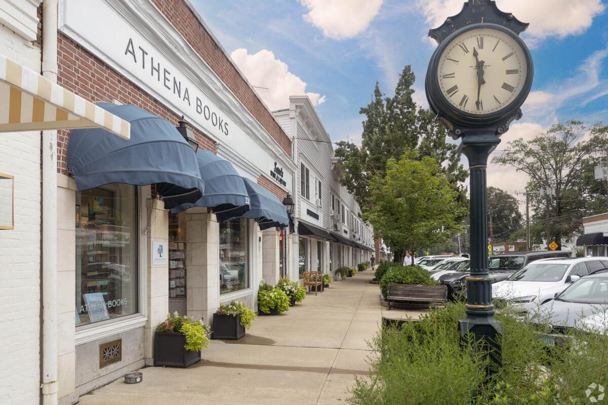 An old-timey clock stands in the middle of Old Greenwich.