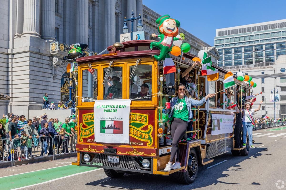 A festive trolley passes by the San Francisco Civic Center during the annual St. Patrick’s Day Parade