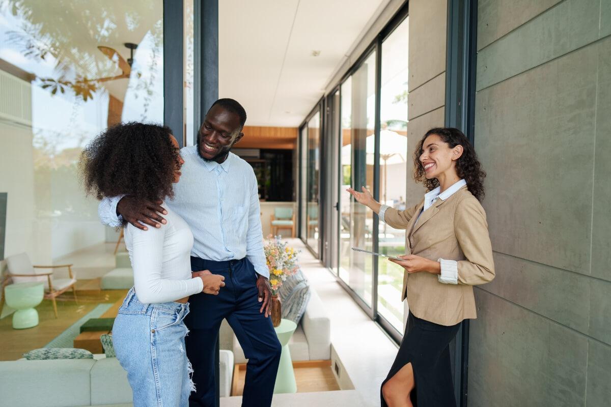 Listing agent gives apartment tour to renters.