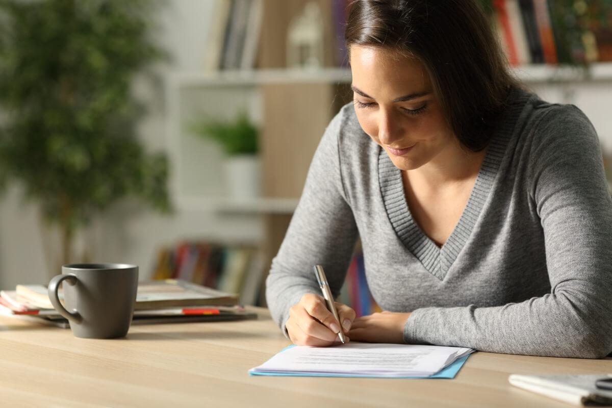 Woman writing a letter.