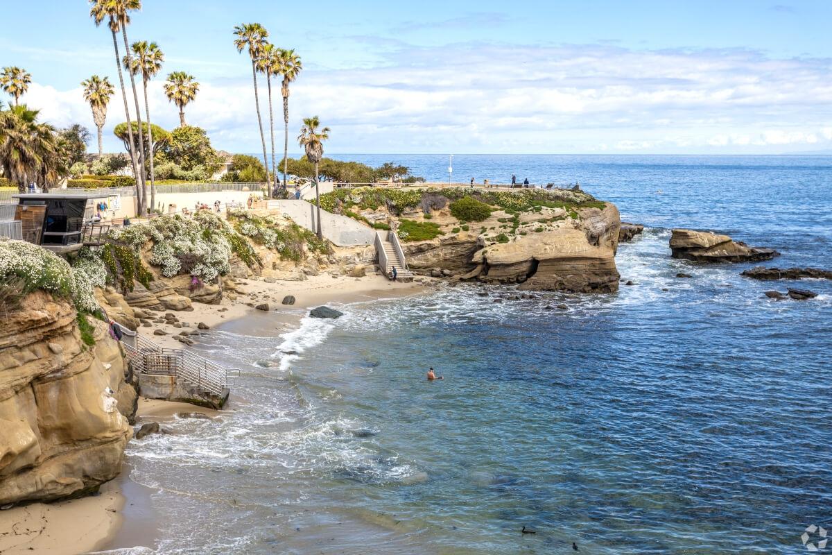 Looking over La Jolla Cove as someone swims in the water.