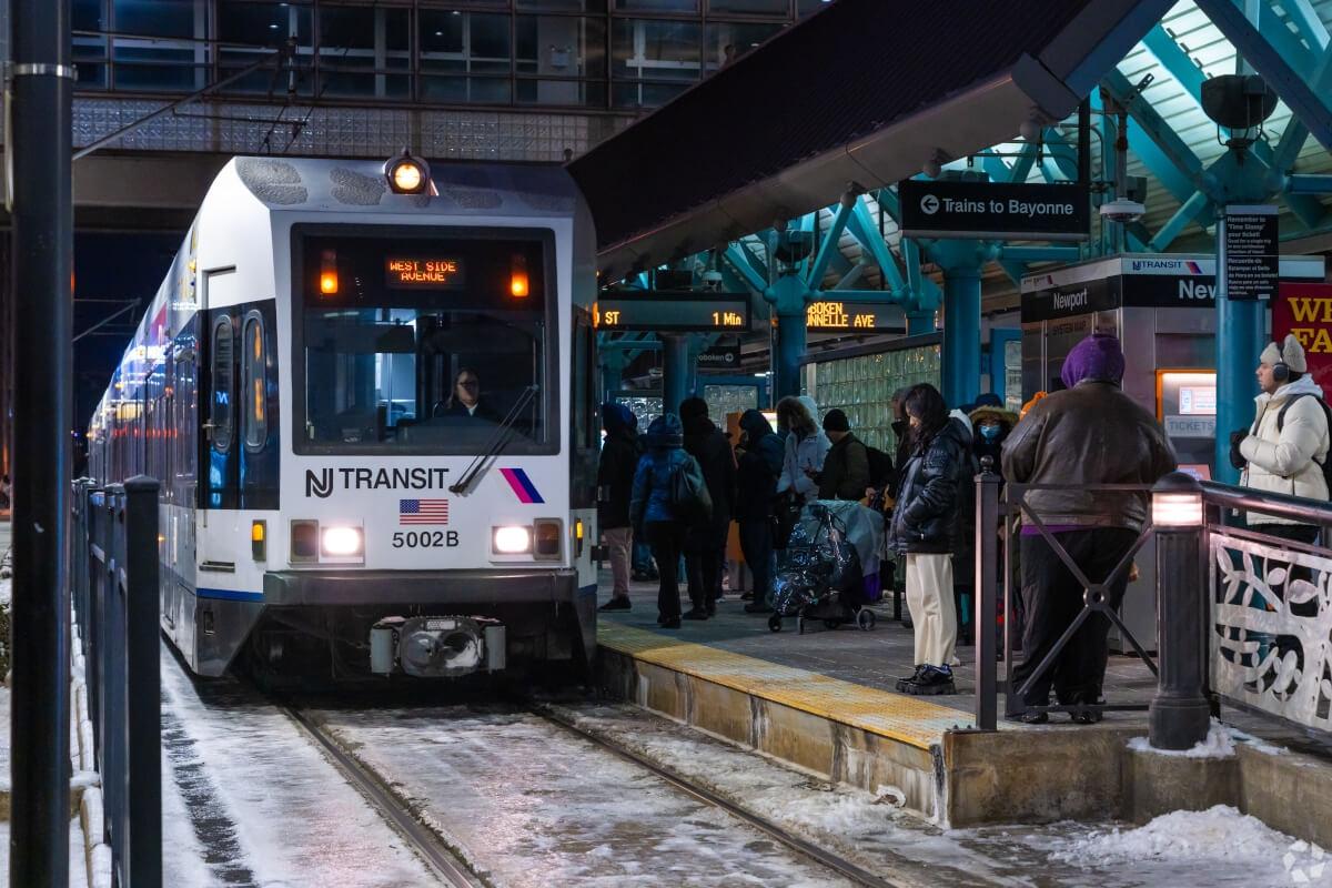 NJ train pulling up to the station.