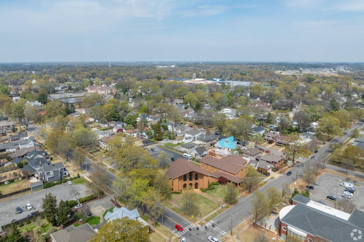 Trees surround houses and building in an Alabaman town.