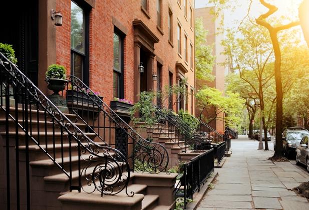 Brownstones lining a New York City street.