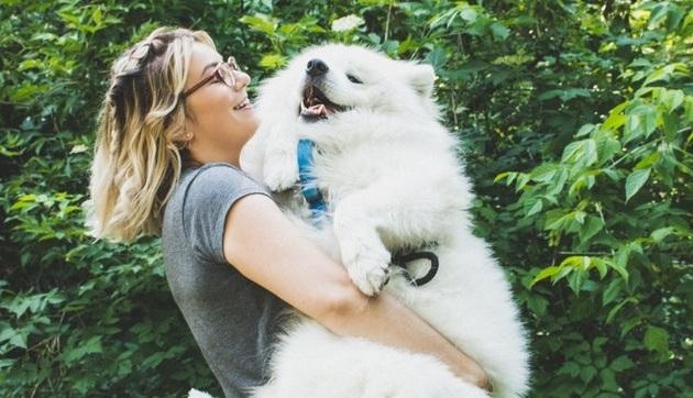 Woman hugging her dog