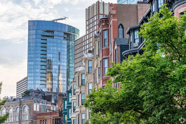 Historic row houses are lined up in Boston, Massachusetts.