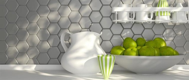 A kitchen scene with a white vase and a bowl of limes