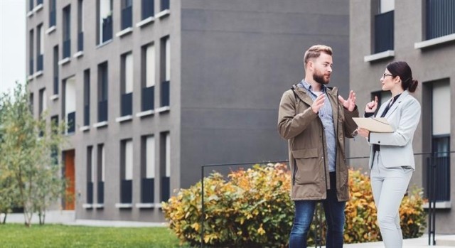 Two people looking at apartments