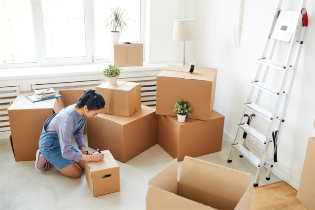 woman packing boxes