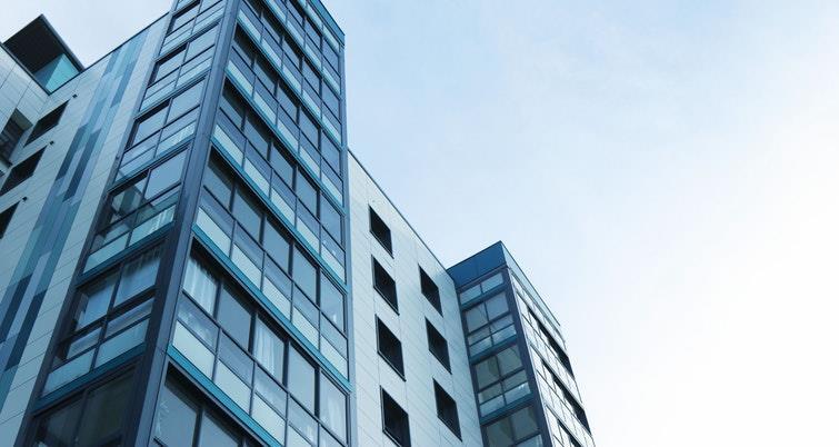 An apartment building viewed from the ground floor