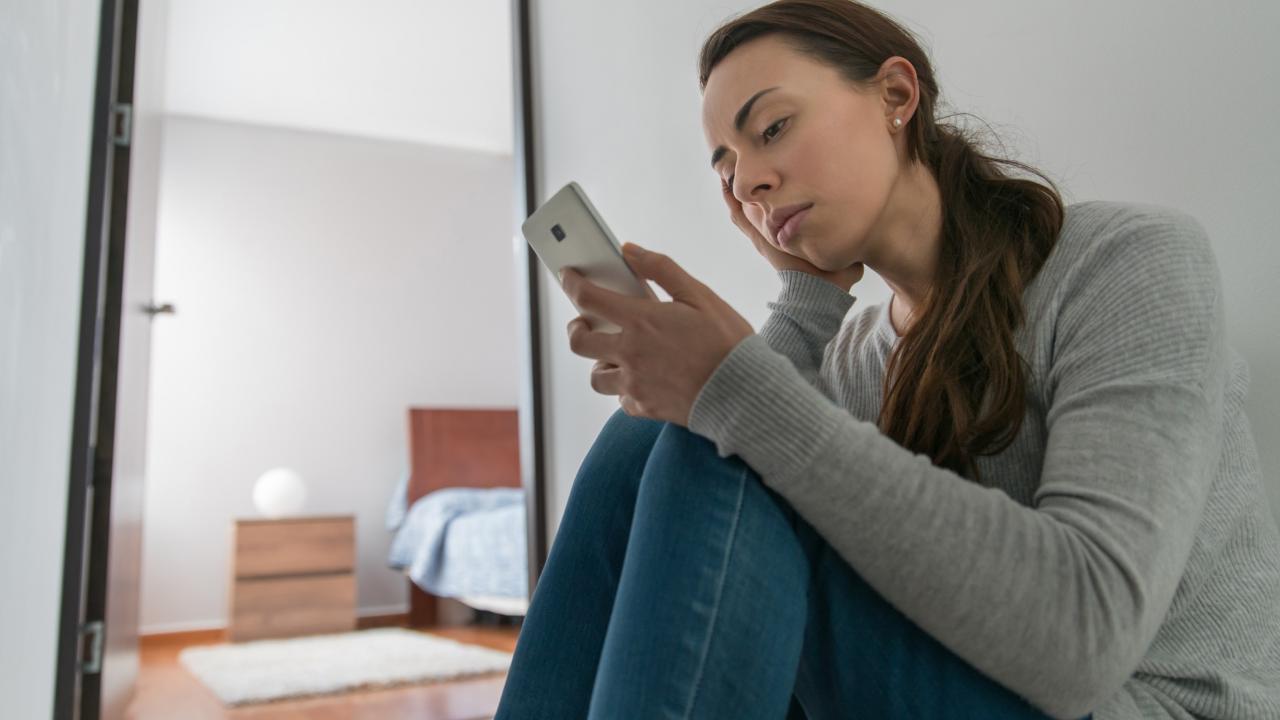 Woman renter looking at phone