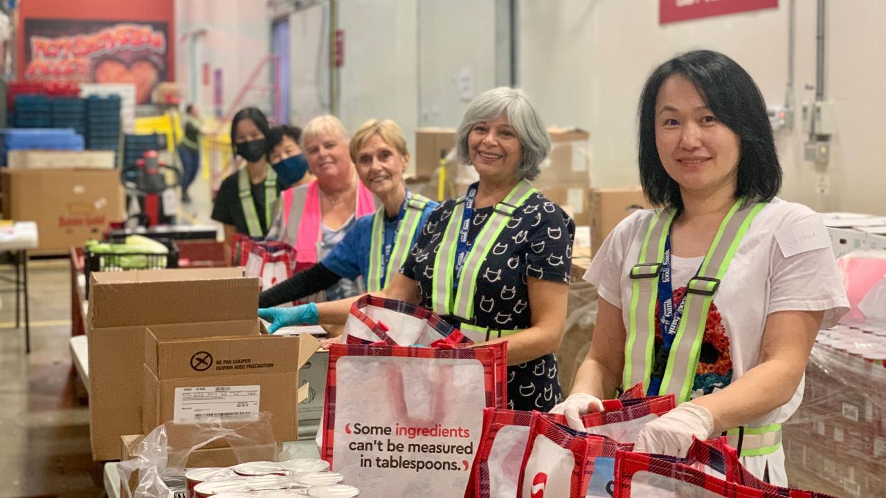 Food Bank Canada works with organizations across the country to fight hunger; here, volunteers pack donations.