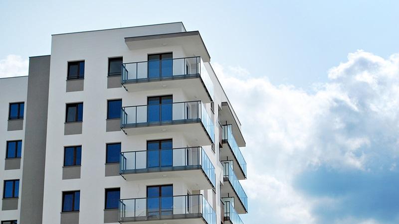 Multifamily building against blue sky