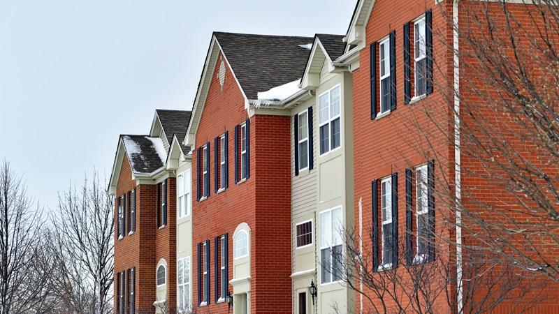 Brick apartments in snow