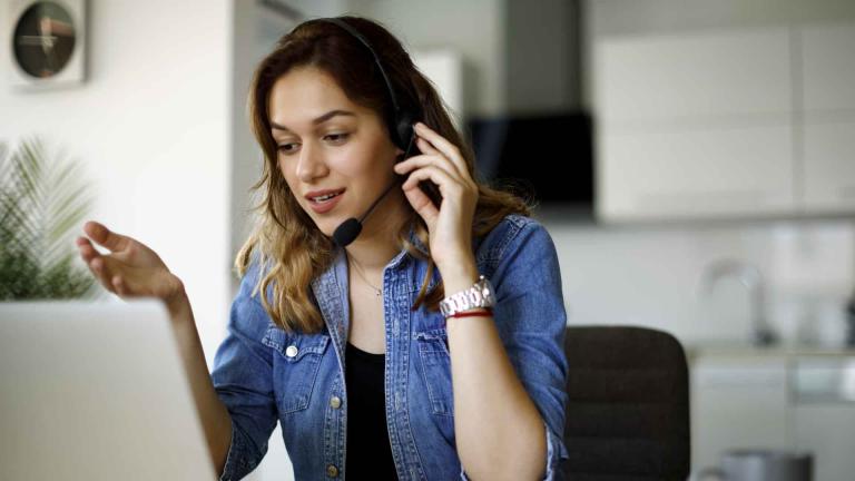 Woman on phone at computer