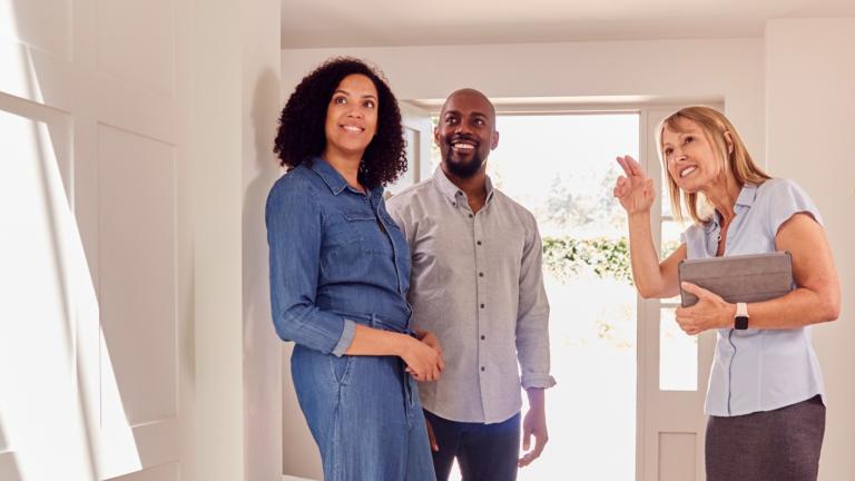 Leasing agent leading prospective renters on an apartment tour