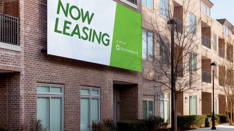 Building with "Now Leasing" banner