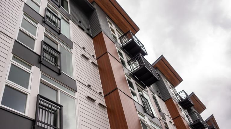 Apartments framed by overcast sky