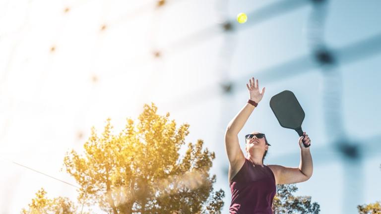 Soaring ball in pickleball game