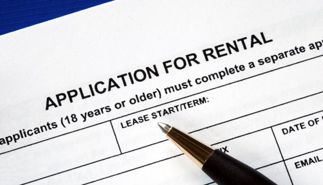 Applicant fills out a rental application. 