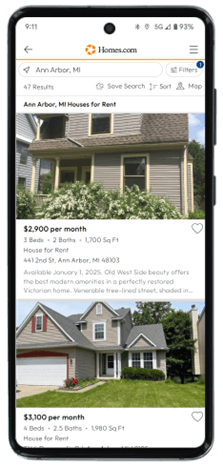 A smartphone shows house rental listings on Homes.com.