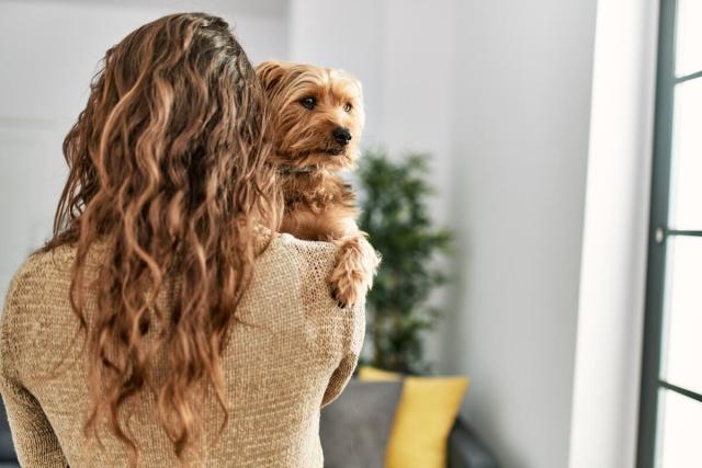 Tenant holds dog. 