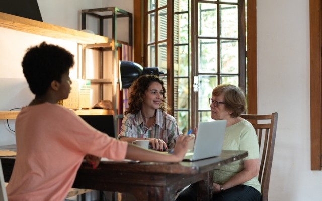 three people discussing