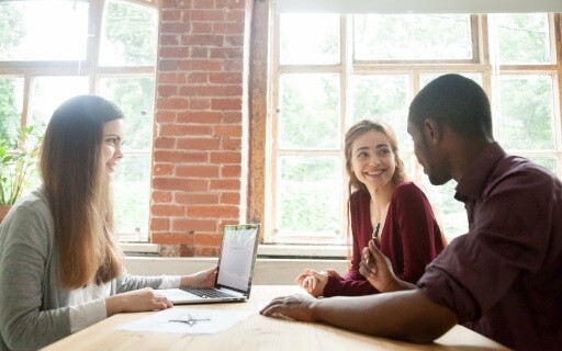 Renters meeting with the landlord in the leasing office