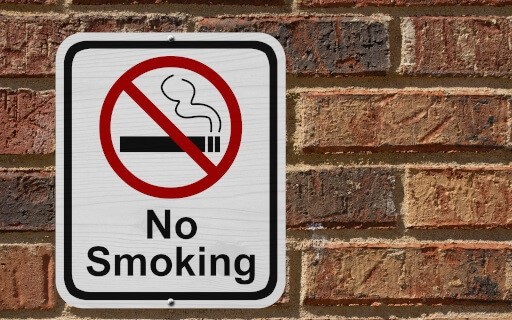 An image of a sign that reads "No Smoking."