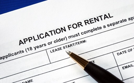 Applicant fills out a rental application. 