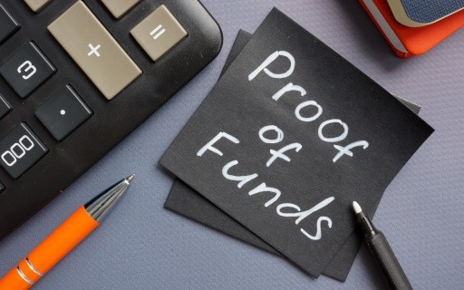 An image of a black sticky note that reads, "Proof of Funds." 