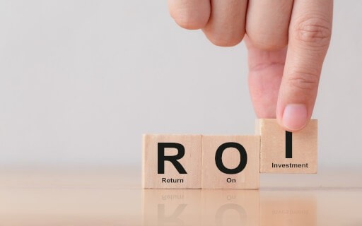 ROI on wooden blocks being placed by a hand.