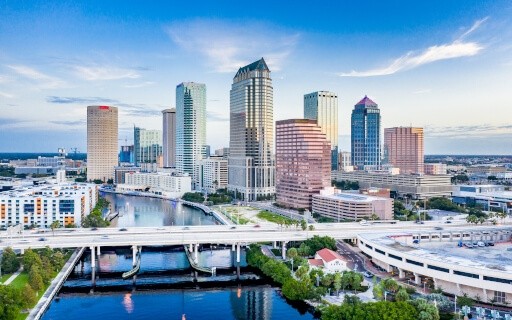 The downtown of Tampa, FL during the day over the river.